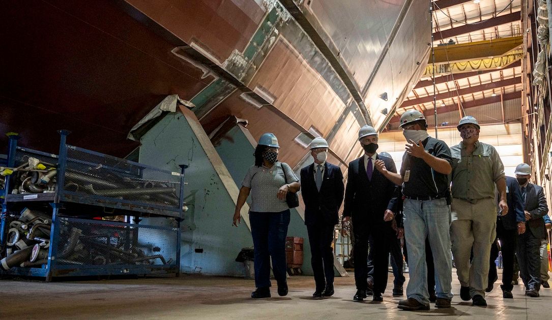 Officials tour the Fincantieri Marinette Marine shipyard in 2020