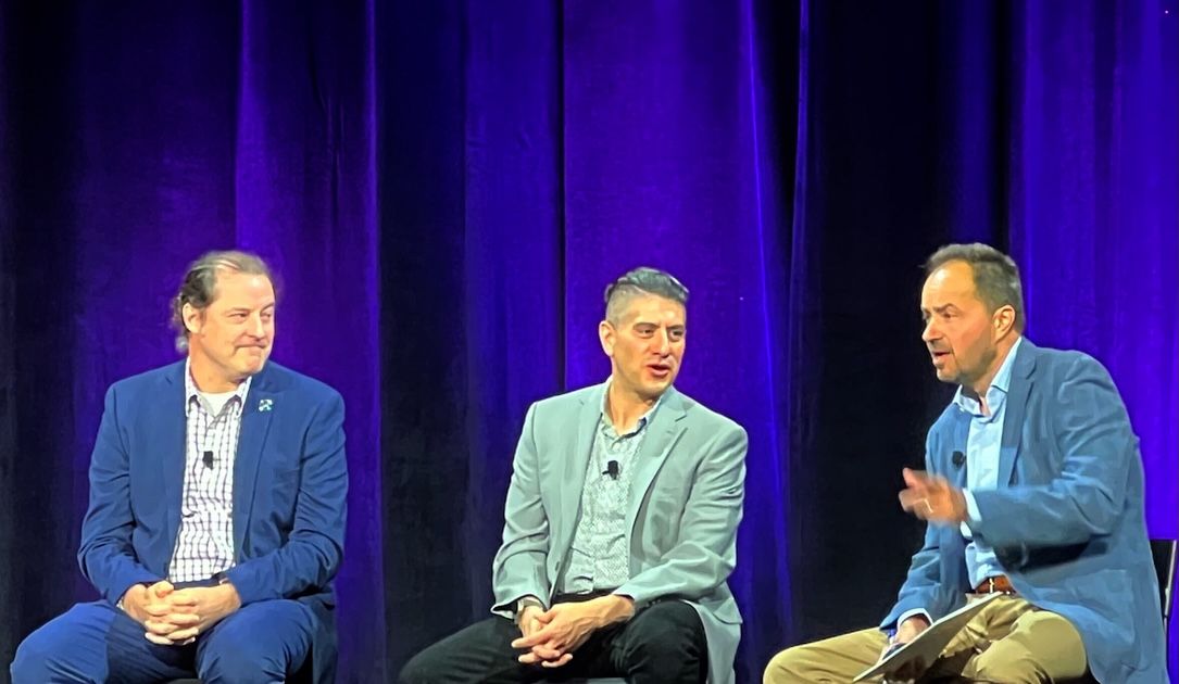 From left, CISA's Chris Butera and Bob Costello speak at the 2025 Black Hat conference in San Francisco with Frank Cilluffo of the McCrary Institute. Image: Jonathan Greig / Recorded Future News