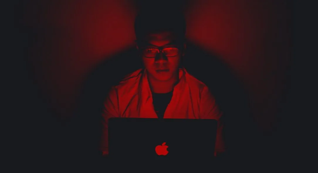 Hacker with a red background