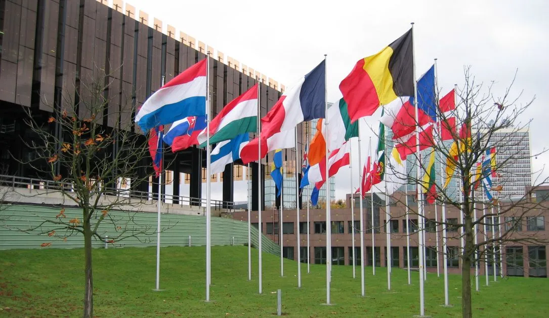 Flags outside the Court of Justice of the European Union. Image: Cédric Puisney via Wikimedia Commons (CC-BY-2.0)