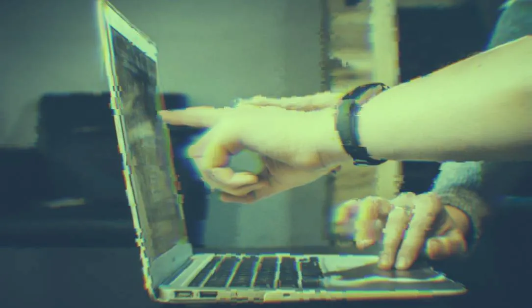 A hand and a computer