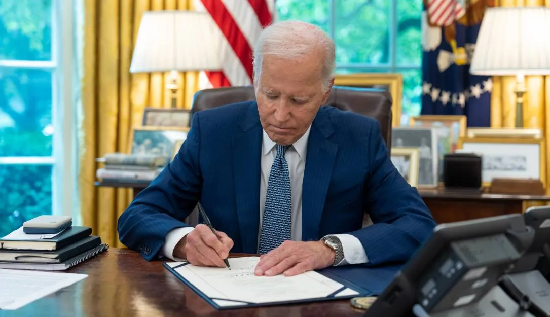 President Joe Biden signing a document