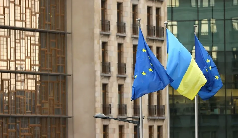 EU and Ukraine flags outside European Council building