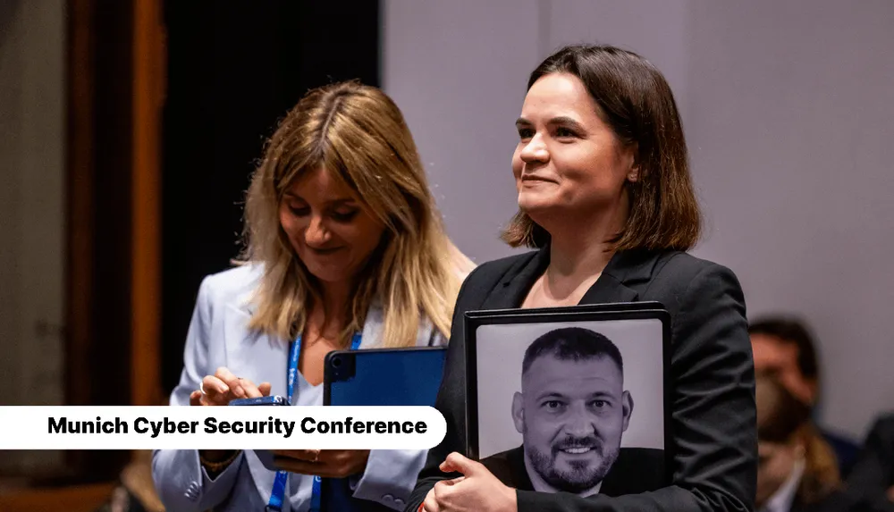 Sviatlana Tsikhanouskaya holding a photo of her husband Sergei, who is imprisoned in Belarus