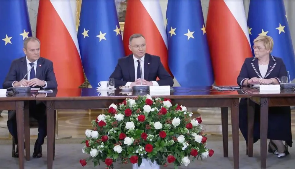 Prime Minister Donald Tusk (left) and President Andrzej Duda (center) at a cabinet council meeting Tuesday