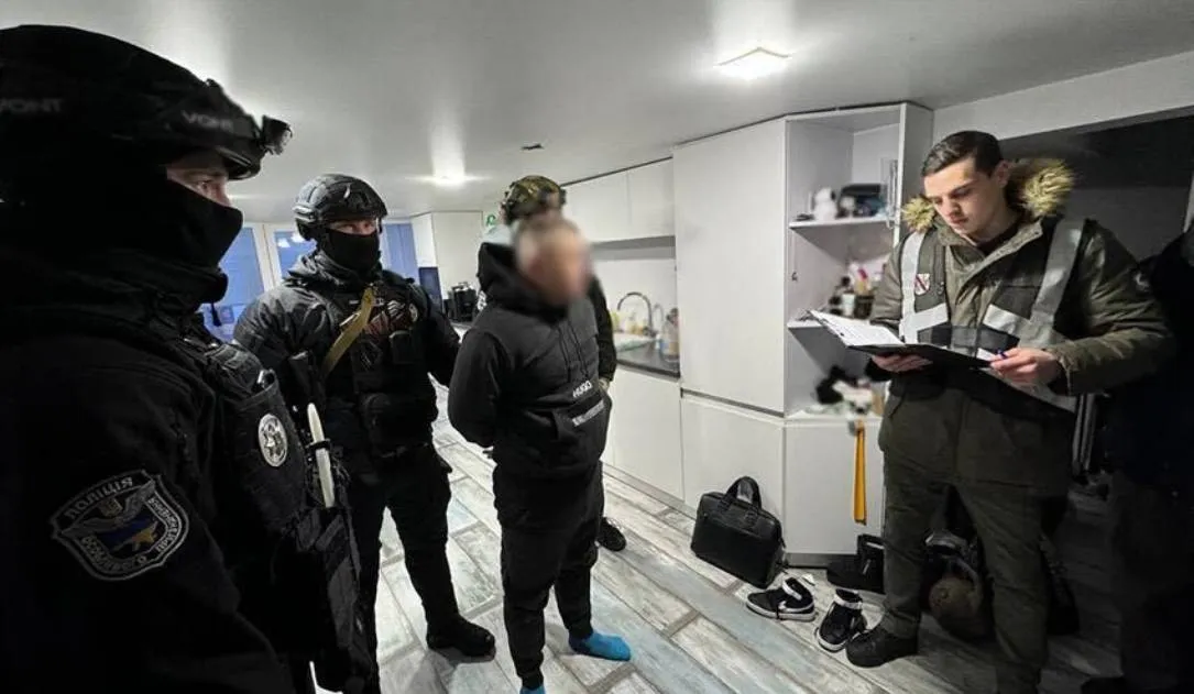A cybercriminal suspect being arrested in Ukraine