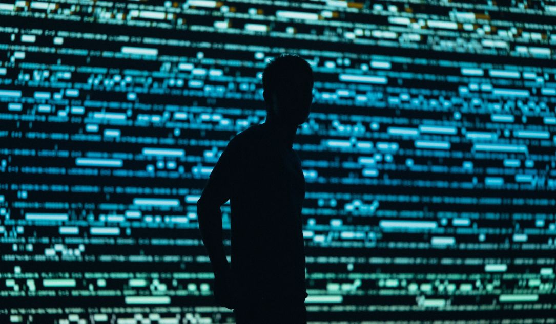 A hacker on a digital screen